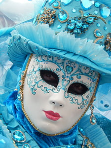 person wearing white and blue face mask thumbnail