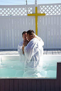 two men standing on pool near yellow cross thumbnail