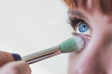 Blue Eyes Getting Makeup Close Up Photo thumbnail