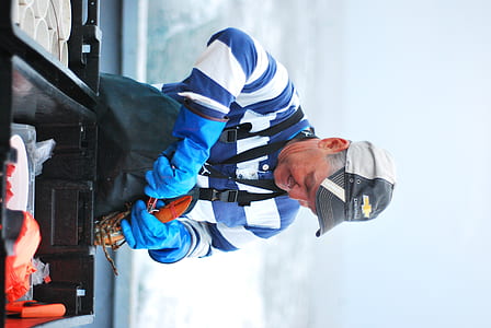 man in blue and white striped long-sleeved shirt thumbnail