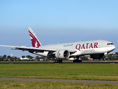 gray Qatar Cargo airliner land on ground thumbnail