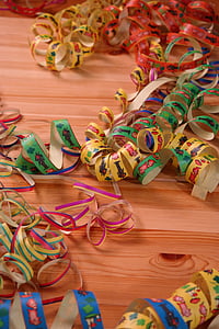 yellow, green, and red textile roll on brown surface thumbnail