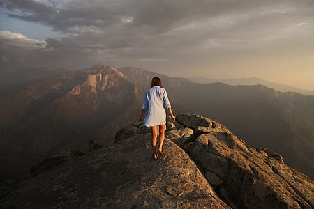 woman walking on mountain top thumbnail