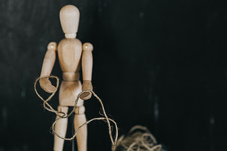 Wooden mannequin in various poses thumbnail