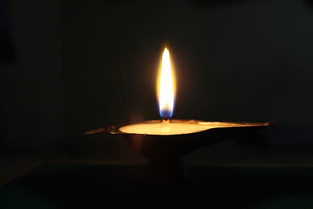 lighted candle kubera lamp thumbnail