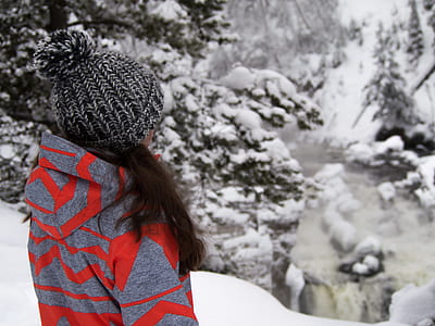girl standing on top of the mountain filled with snow thumbnail