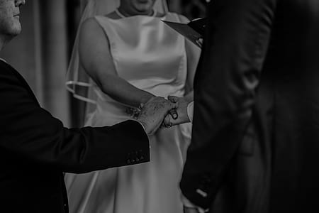 grayscale photo of man and woman in wedding ceremony thumbnail