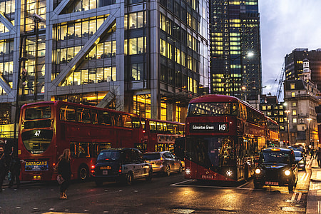 Traffic of taxis, buses and cars on the streets of London at sunset thumbnail