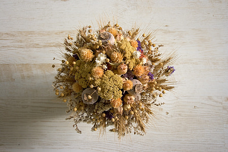 brown and orange flower decoration on beige surface thumbnail