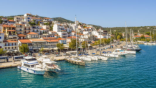 white ships surrounded by concrete buildings thumbnail