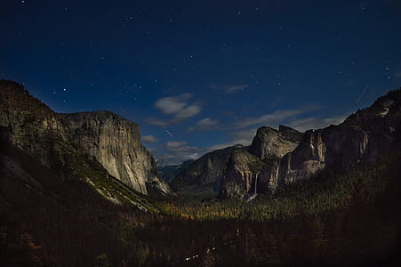 mountain surrounded by trees during nighttime thumbnail
