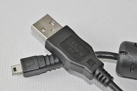 black USB to micro USB cable on white textile thumbnail