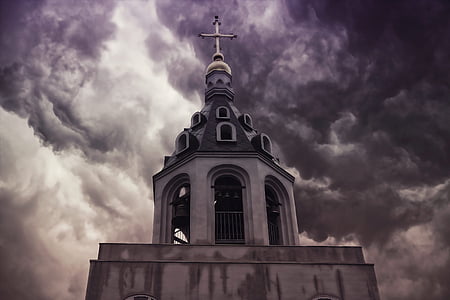 landscape photography of church under cloudy sky thumbnail