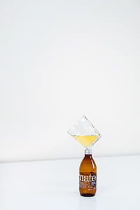 shot glass balancing on mate labeled bottle thumbnail