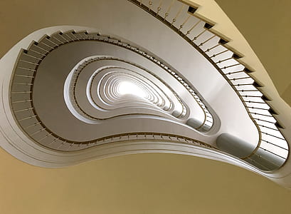 worms eye view of white spiral staircase thumbnail