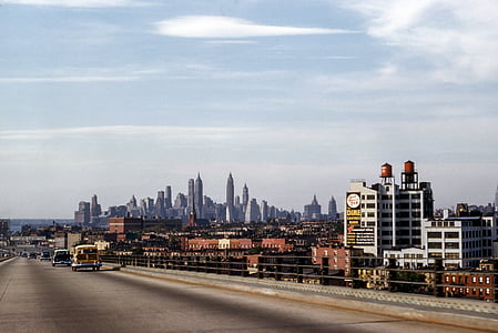 landscape photo of road near buildings during daytime thumbnail