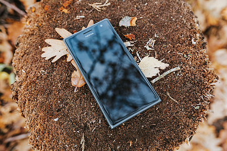 Black mobile phone on the ground thumbnail