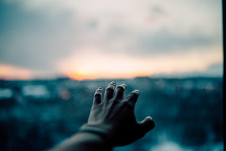 person showing left hand thumbnail