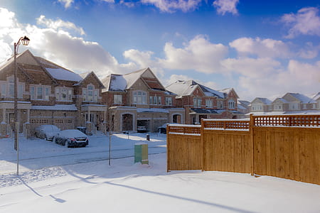 Brown 2-storey Houses during Snow thumbnail