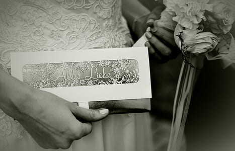 person holding purse and flower bouquet thumbnail