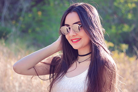 woman wearing white tank top and sunglasses selected focus photography thumbnail
