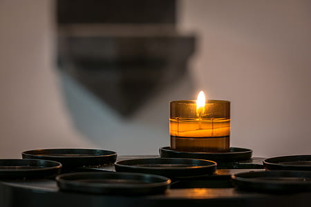 selective focus photo of brown lighted candle thumbnail