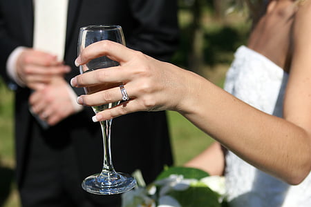selective focus photography of woman holding clear wine glass thumbnail