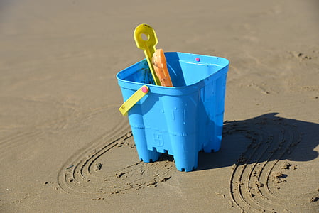 blue sand bucket on gray sand thumbnail