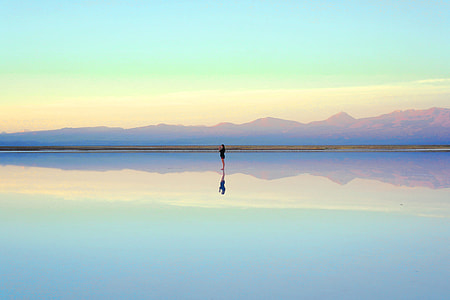 woman standing on reflective desert thumbnail