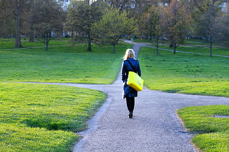 woman walking on the pathway thumbnail