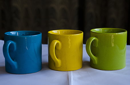 three assorted-color ceramic mugs thumbnail