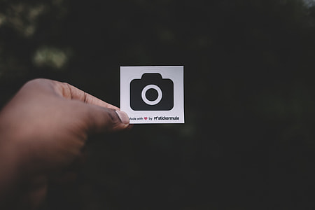 person holding card with camera graphic thumbnail