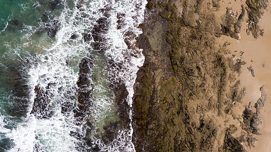 body of water rushing in to the rocks thumbnail