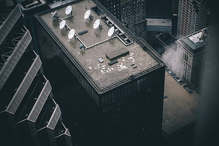 satellite dishes on building roof thumbnail