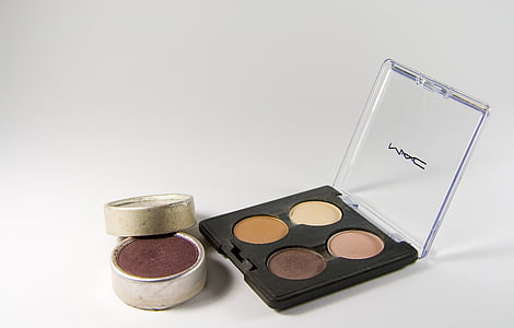 MAC eyeshadow palette beside blush palette on white surface thumbnail