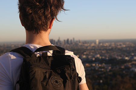 man wearing black backpack thumbnail