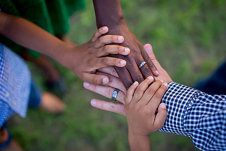 selective focus photograph of family hands thumbnail