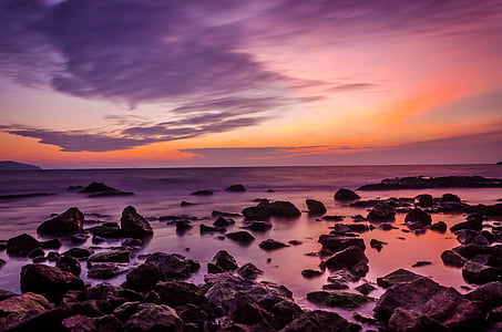 stones on body of water during sunset thumbnail