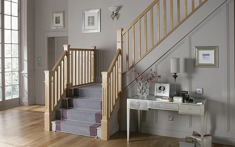 gray wooden console table near staircase thumbnail