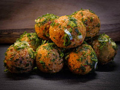 deep fried balls with green leaves thumbnail