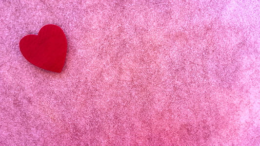 red heart cutout paper on pink background thumbnail