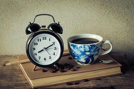 filled white and blue floral ceramic cup with alarm clock thumbnail