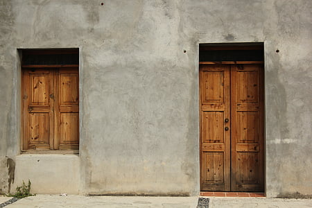 closed brown wooden door and window thumbnail