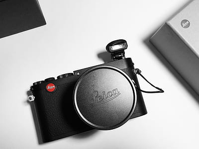 black Leica camera on white surface thumbnail