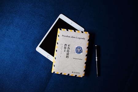 white iPad under gray and blue smart case thumbnail