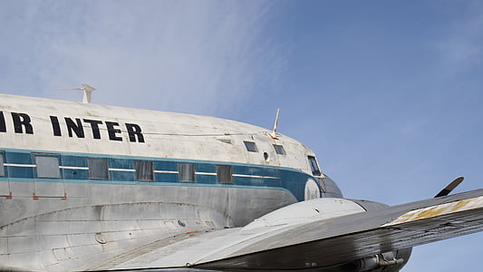 white and gray airplane under white and blue sky thumbnail