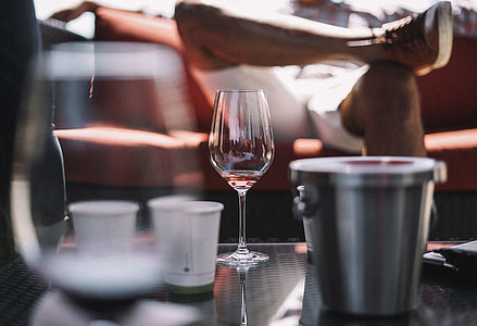 selective focus photography of wine glass beside bucket thumbnail