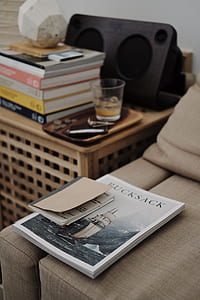 Bucksack book on bed beside table thumbnail
