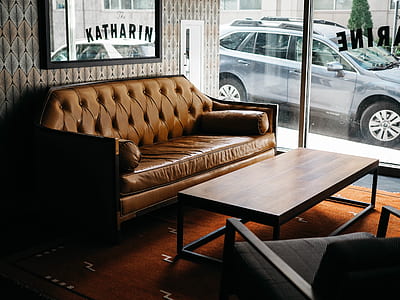 brown leather sofa near clear glass wall thumbnail