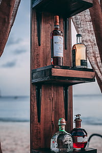 four labeled bottles on rack thumbnail